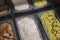 Various types of ice cream in trays on display in a store. Creamy, pistachio, coffee.