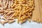 Various types of pasta on stone table