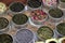 Various types of tea in metal pots exposed for sale in a Chinese tea shop in Shanghai