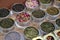 Various types of tea in metal pots exposed for sale in a Chinese tea shop in Shanghai