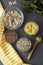 Various uncooked cereals. Different types of groats in bowls on gray background, top view, close up. Healthy nutrition food