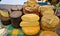 Various varieties of tasty and healthy cheese on the counter of the collective farm market