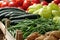 Various vegetables displayed in wooden cases on marketplace