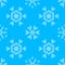 Various white crochet snowflakes on blue background.