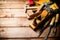 Various working tools on wood on the table.