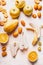 Various yellow and orange colors fruits flat lay on white desk, top view. Healthy food