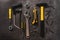 Various yellow repair tools, equipment for building. Grey background top view