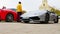 VARPALOTA, HUNGARY - APRIL 13, 2019: View on a Lamborghini sport car slowly passing by a Ferrari car in Varpalota, Hungary on the