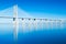 Vasco da Gama Bridge mirrored in The Tejo River, Lisbon, Portugal