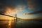 Vasco da Gama bridge with sun rising under it