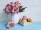 Vase alstroemeria flower romancebox macaron colored wooden background, breakfast blue wooden bake