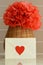 Vase basket with red tissue paper flower on kitchen counter top