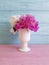 Vase of a beautiful peony spring plant gentle soft anniversary wooden background fresh