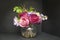 Vase of Beautiful Tulips flowers and snowdrops isolated on black