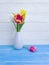 Vase bouquet of tulips decor home springtime colorful romantic elegance on wooden background