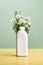 A vase with daisies in it on a table. Generative AI image. Beauty product bottle mockup.