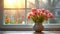 A vase filled with pink tulips sitting on a table in front of a window