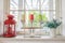 Vase with a flower and candle on the windowsill country house