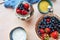 Vase with fresh berries, product set for breakfast