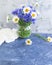 Vase fresh  bouquet cornflower  chamomile on summer   concrete background