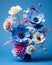 a vase full of colorful flowers on a blue background