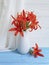 Vase orange lily retro holiday composition design on a wooden background textiles