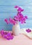 Vase orchid flower bouquet creative freshness modern decorate elegance arrangement on a wooden background