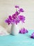 Vase orchid flower bouquet creative freshness vintage modern decorate elegance arrangement on a wooden background