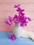Vase orchid flower bouquet freshness vintage modern decorate elegance arrangement on a wooden background