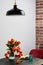 Vase of red slowly fading tulips in a modern living room - home decor, selective focus