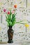 Vase with tulips in spring backgroud