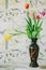 Vase with tulips in spring backgroud
