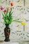 Vase with tulips in spring backgroud