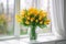 Vase with yellow tulips against the background of a window