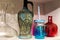 Vases on the shelf, colorful vase for vine and flowers, green, red, pink, blue and glasses vase.