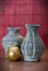 Vases of terracotta and yellow candle