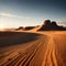 A vast African landscape scene, with a dirt road running through barren flat plains in the Namib Desert toward the