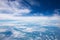 Vast of cloudy and bluesky background. View from airplane.