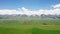 Vast grasslands and mountains in a fine day