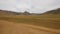 Vast hilly landscape in the Mongolian steppe. Pan view footage over the horizon over land