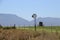 Vast landscape in southern South Africa. Windmill, field, and mountains.