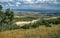 Vast landscape, valley with highway, rock formations and reservoir, Utah