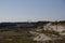 The vast limestone quarry, a scar in the ground, is no longer used. Instead it is a protected area in MalmÃ¶, Sweden. The Oresund