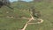 Vast lush green Tea Plantation covering the arid mountains of Munnar, India - Aerial slow tilt down reveal shot