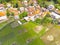 Vast rice fields surrounding a residential area