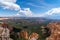 Vast view of forests and red rock in Utah Bryce Canyon National Park, with blue sky