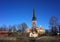 Vasteras Cathedral with old yellow houses in old town