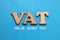 VAT Value added tax, text words typography written on paper against blue background, life and business motivational inspirational