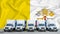 Vatican flag in the background. Five new white trucks are parked in the parking lot. Truck, transport, freight transport. Freight
