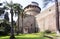 Vatican garden, stone steda with tower, trees, palm trees, lawn
